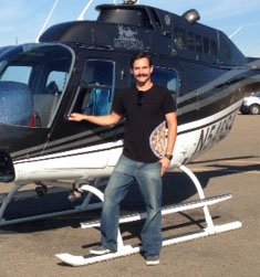 Man stands next to helicopter